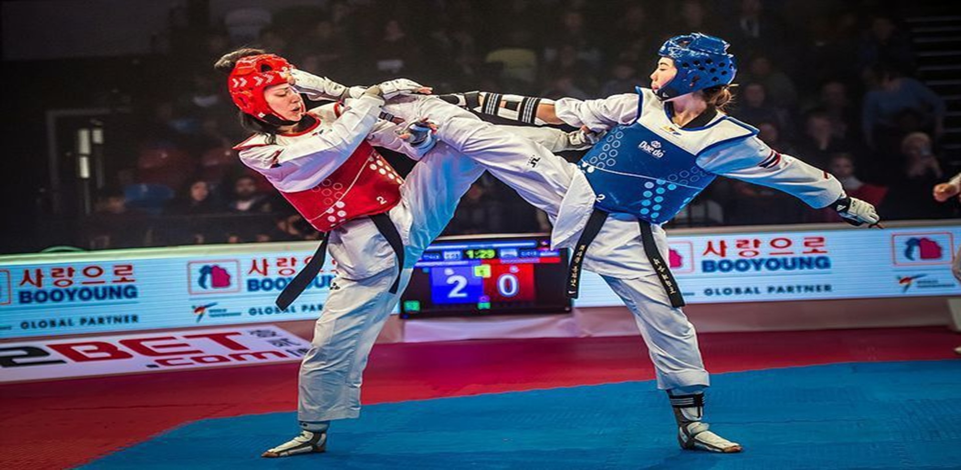 Two athletes in a Taekwondo bout