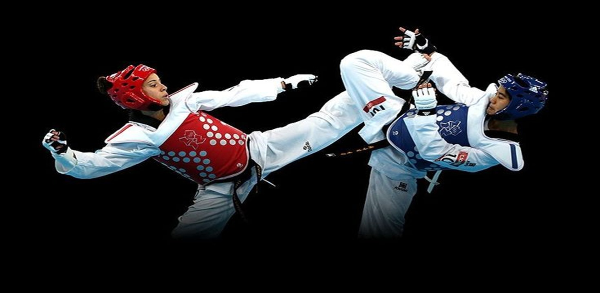 Taekwondo athletes executing high kicks